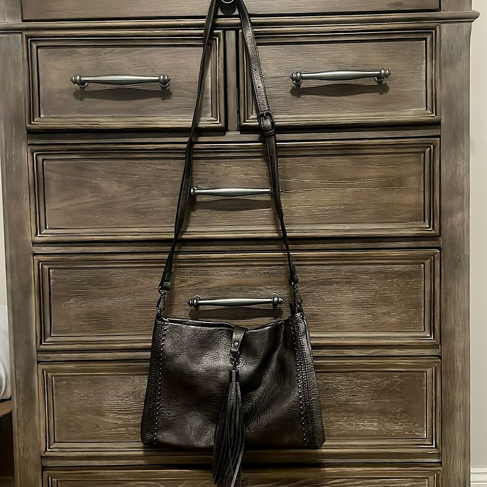 Pewter studded purse with tassel. Never used.